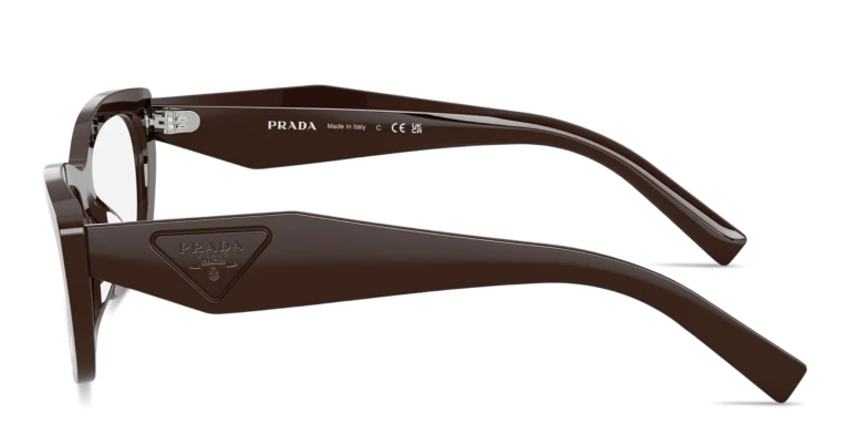 Shop PRADA Engraved Logo Irregular Eyeglasses in Brown online.