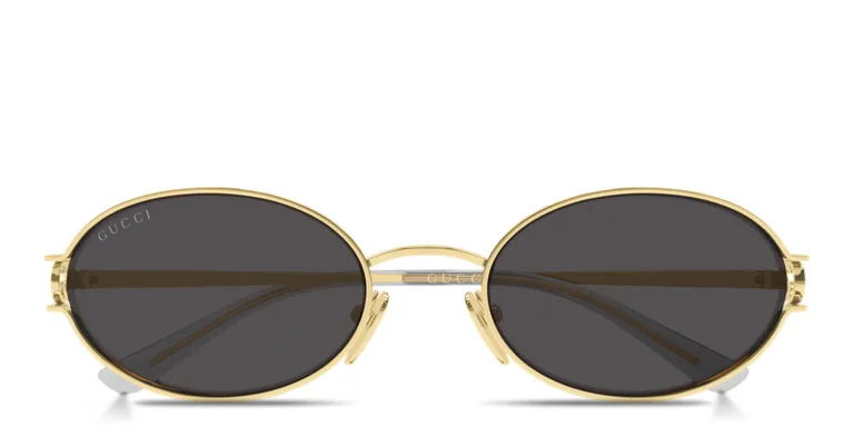 Shop GUCCI GG Logo Oval Sunglasses in Gold online.