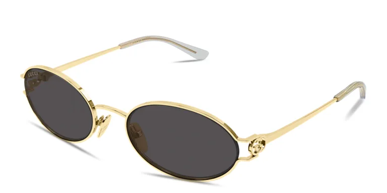 Shop GUCCI GG Logo Oval Sunglasses in Gold online.