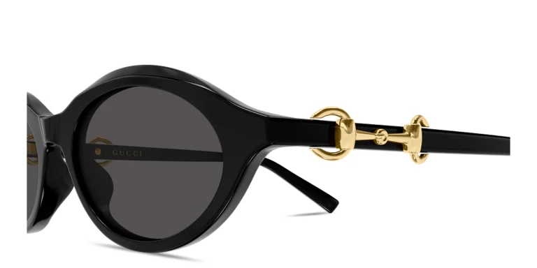 Shop GUCCI Horsebit Oval Sunglasses in Black online.