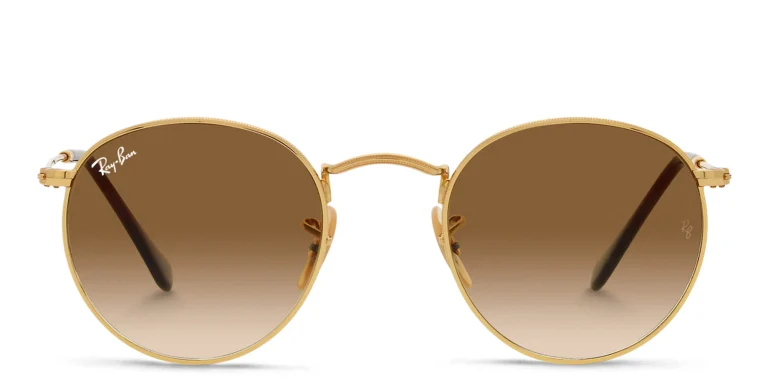 Shop Ray-Ban Round Metal Sunglasses in Gold online.